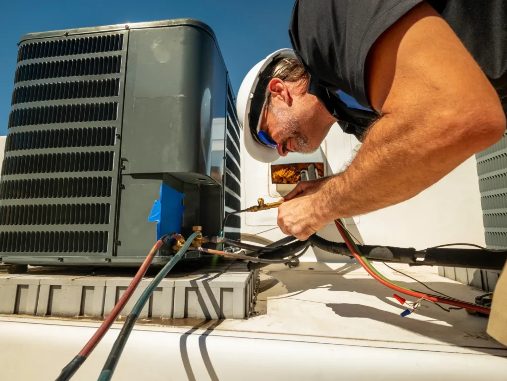 A man working on an air conditioner