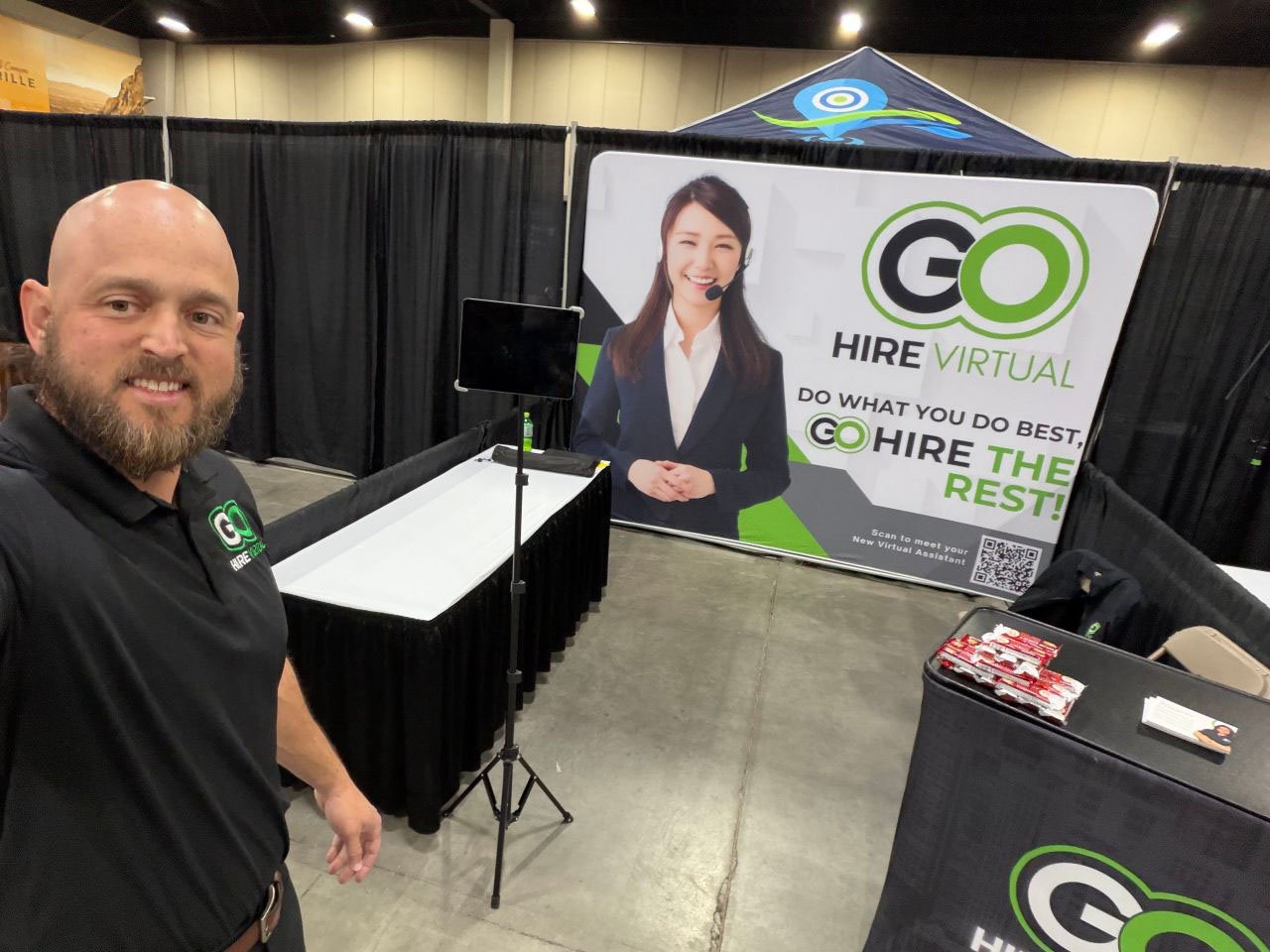 Go Hire Virtual team member at a small business expo booth
